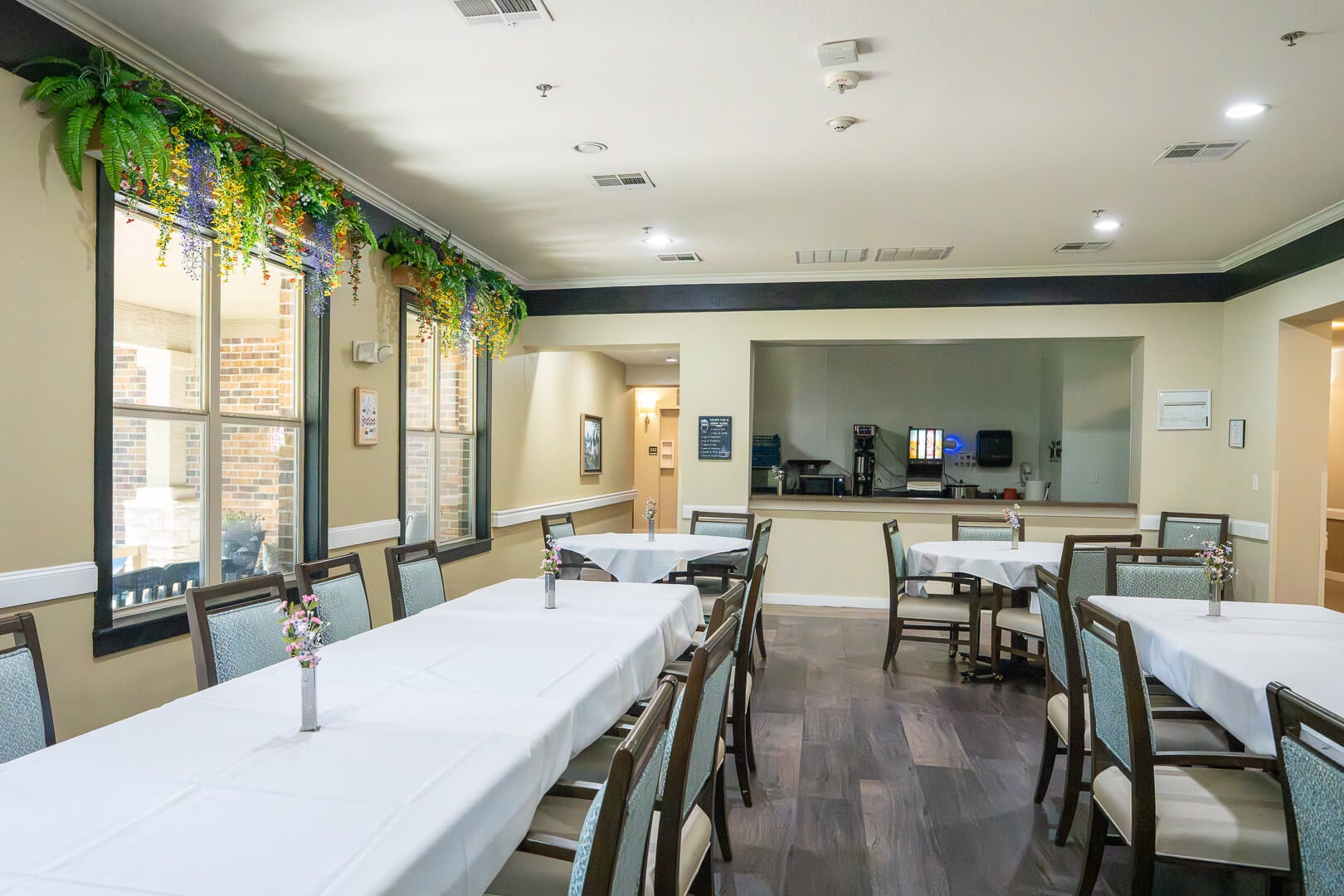 Main Dining Hall With Decorative Ceiling Details at Memory Care Facility