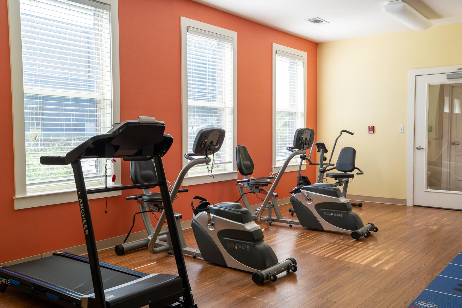 Modern Fitness Center With Exercise Equipment at Assisted Living and Memory Care
