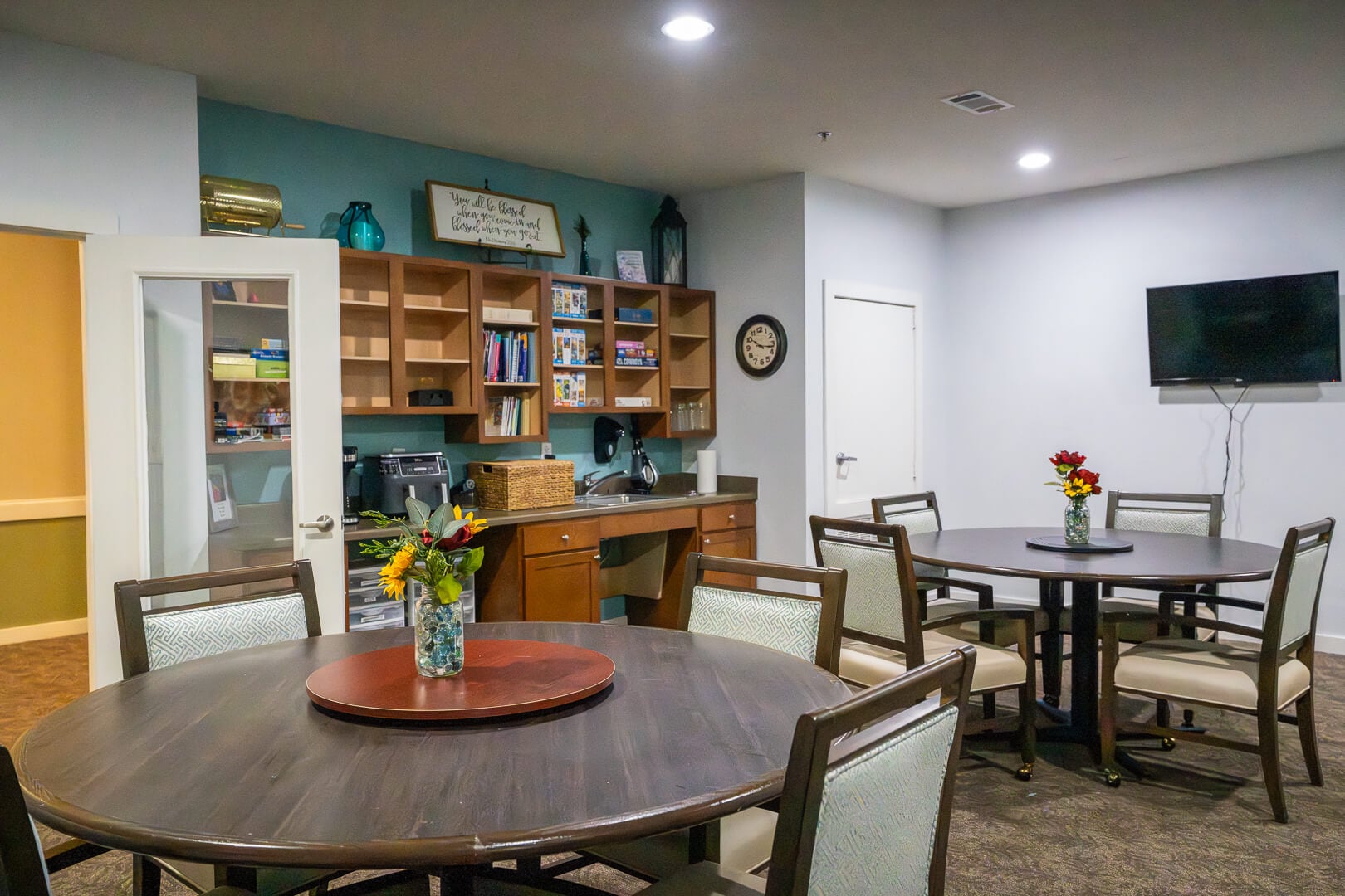 Activity Room With Books and Tables at Assisted Living Facility