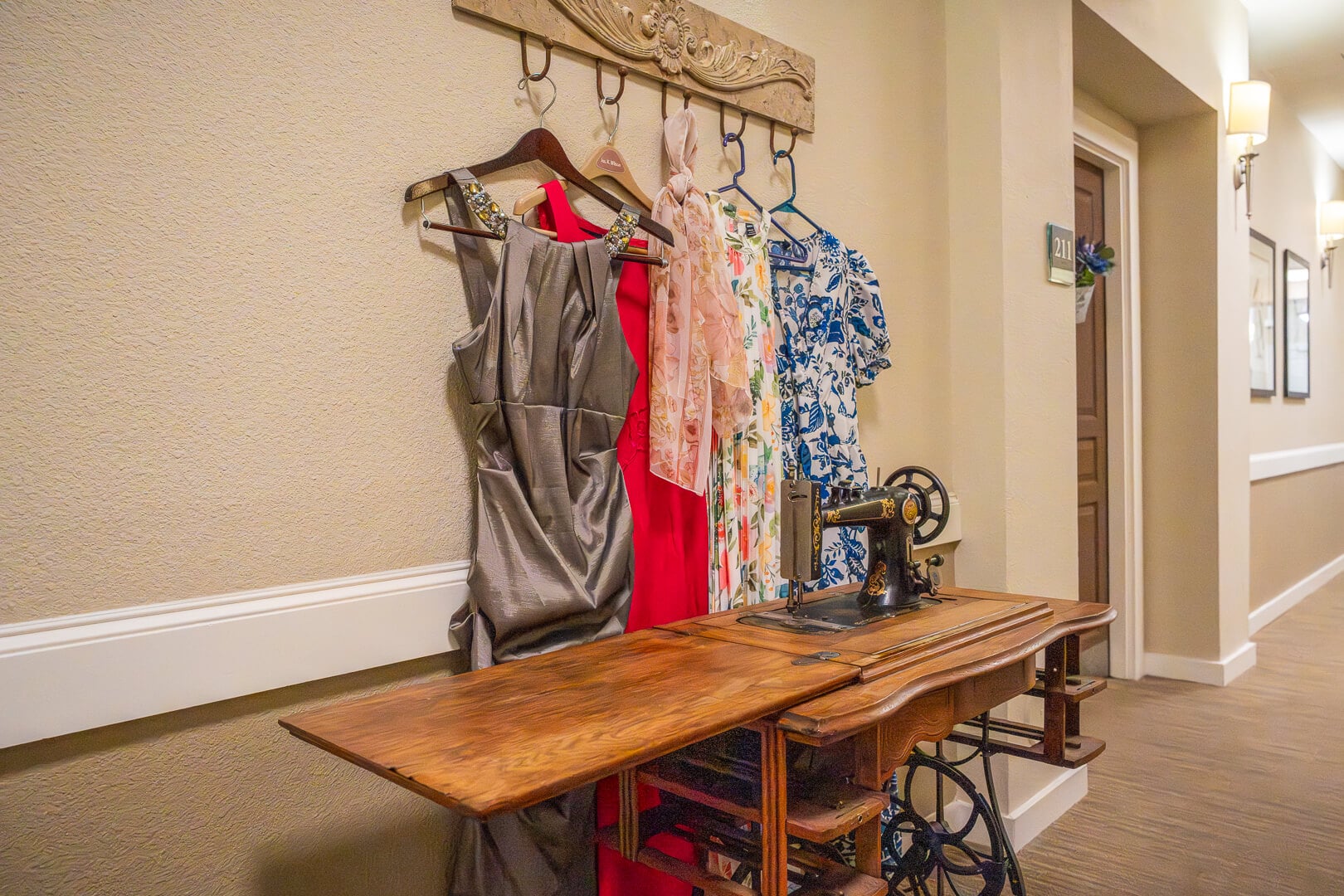 Vintage Sewing Station With Colorful Dresses at Memory Care Facility