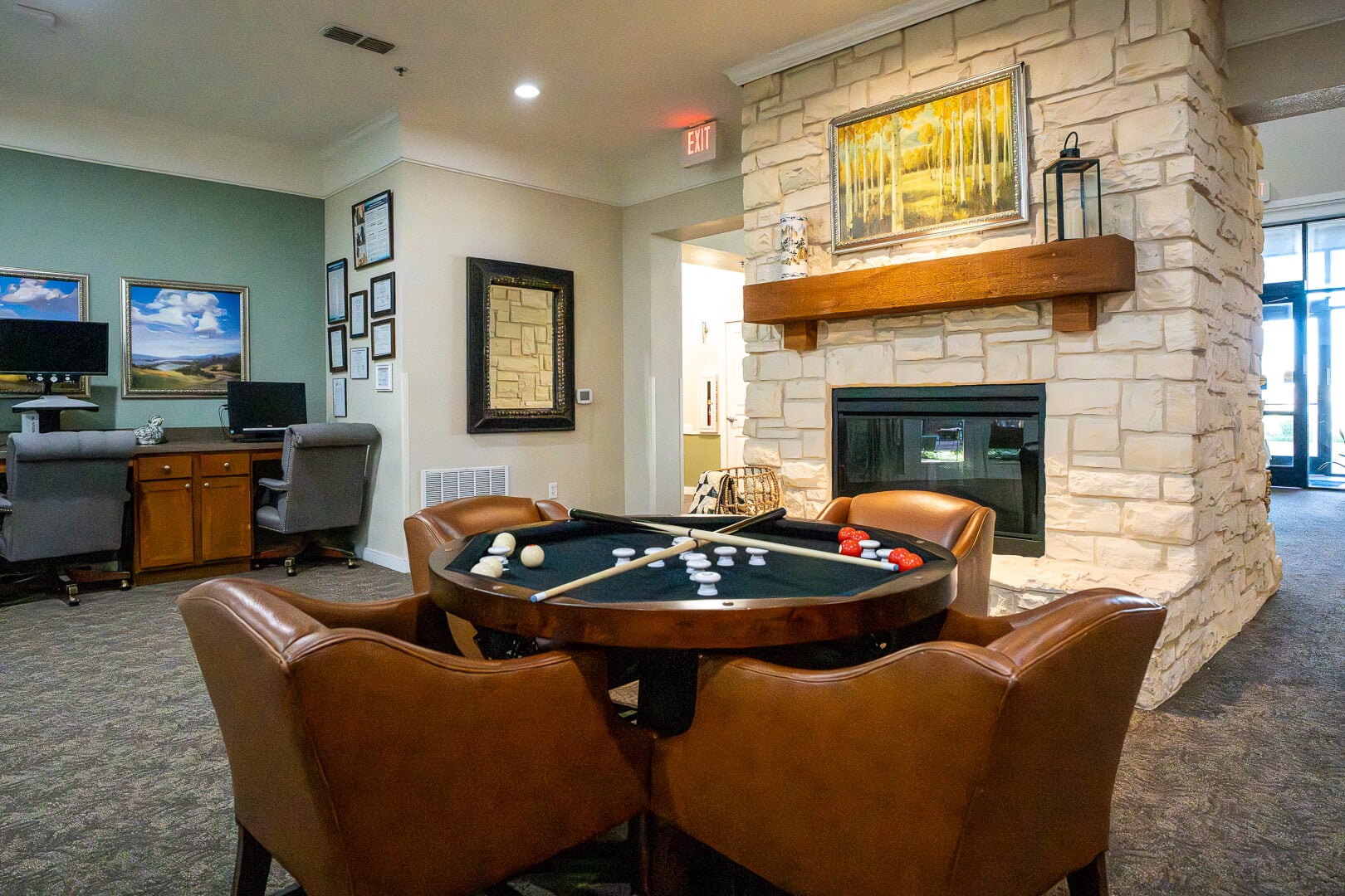 Game Room With Pool Table and Stone Fireplace at Assisted Living and Memory Care