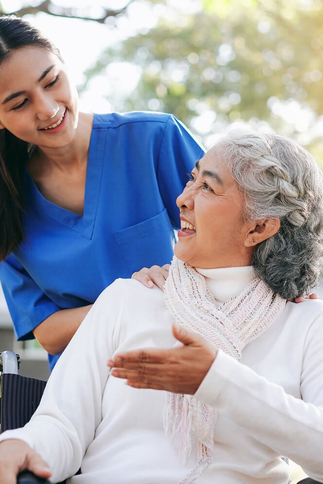 Nurse Comforting Elderly Woman at Nursing Home Colleyville