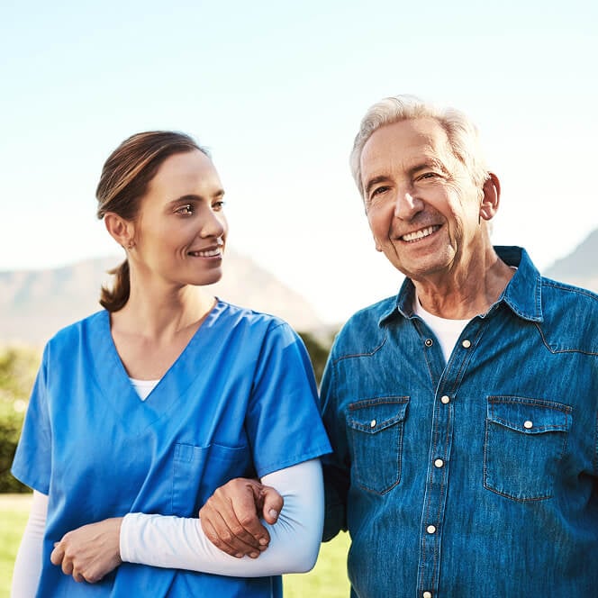 Caregiver Comforting Resident at Memory Care Facility